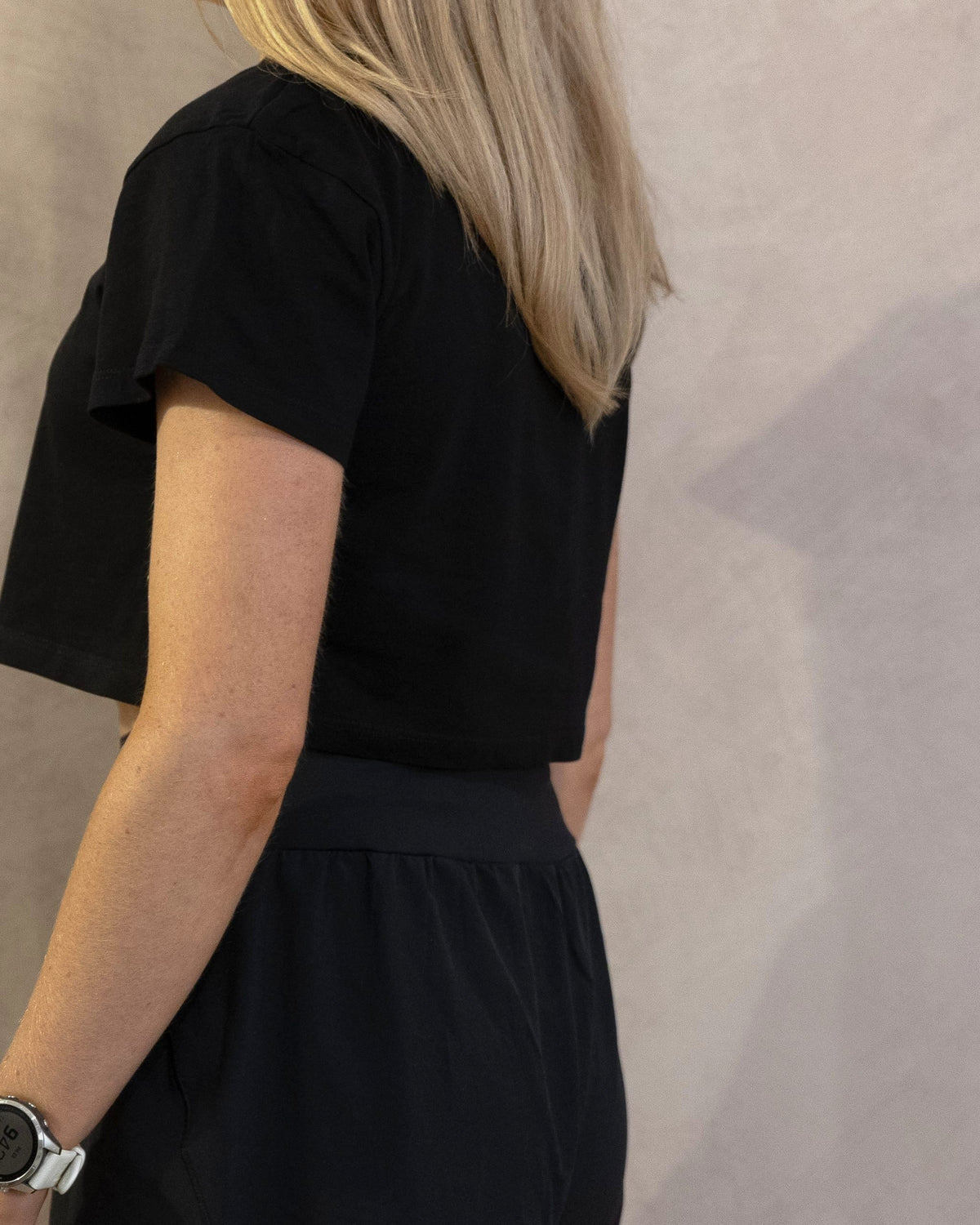 The Cristal Crop in Black, back three-quarter, worn by a 5ft 6 model in size XS
