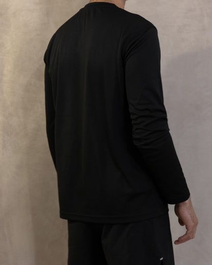 The Fondo Long Sleeve in Jet Black, back, worn by a 6ft model in size Large