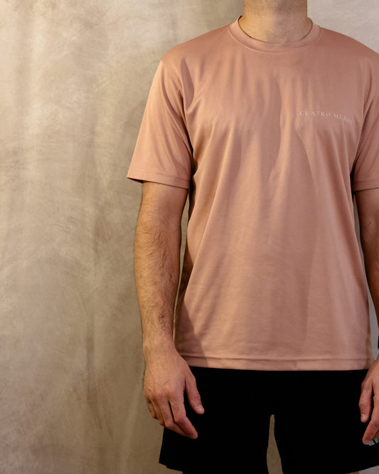 The Sombra Tee in Dusty Pink, front, worn by a 6ft model in size Large