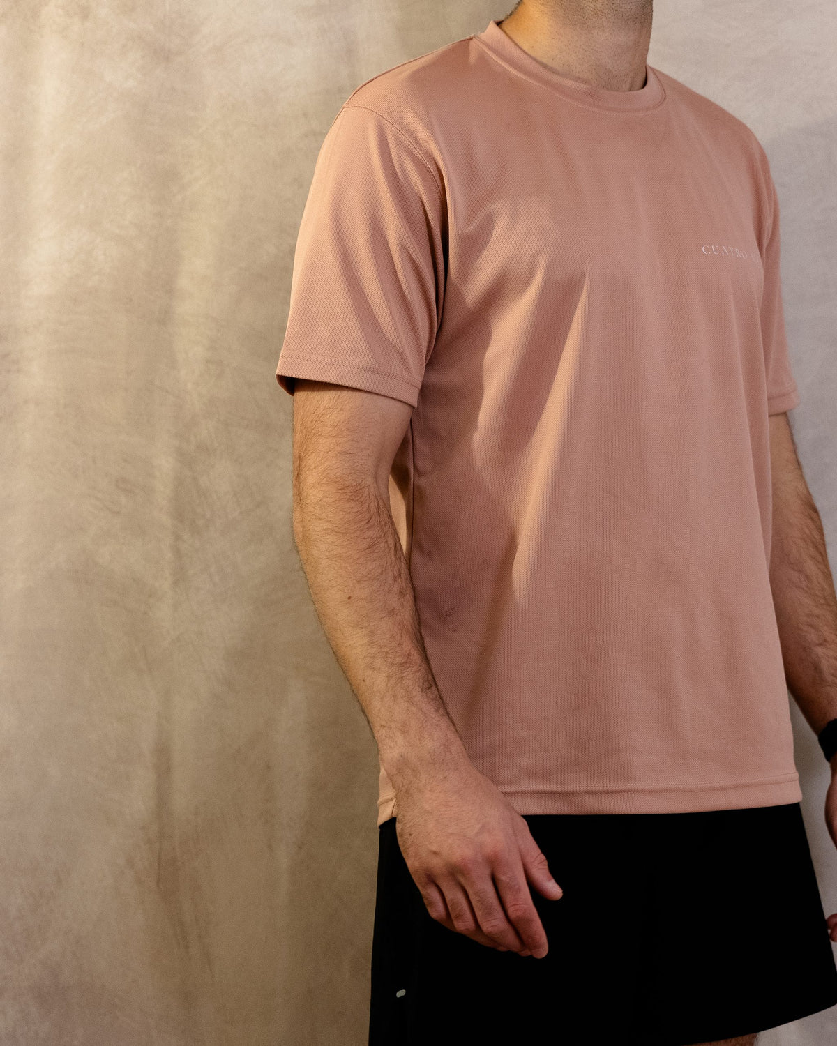 The Sombra Tee in Dusty Pink, three-quarter front, worn by a 6ft model in size Large