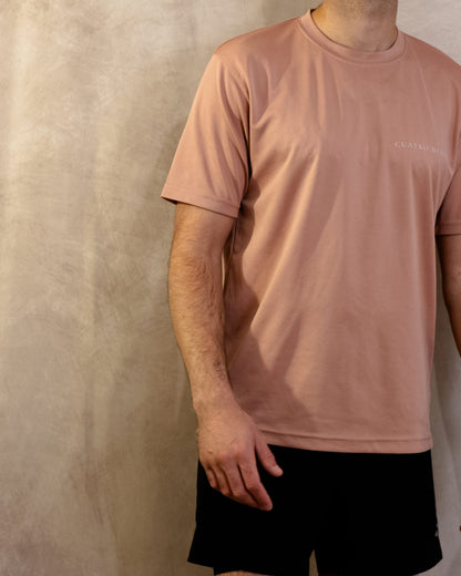 The Sombra Tee in Dusty Pink, front with a slight turn, worn by a 6ft model in size Large